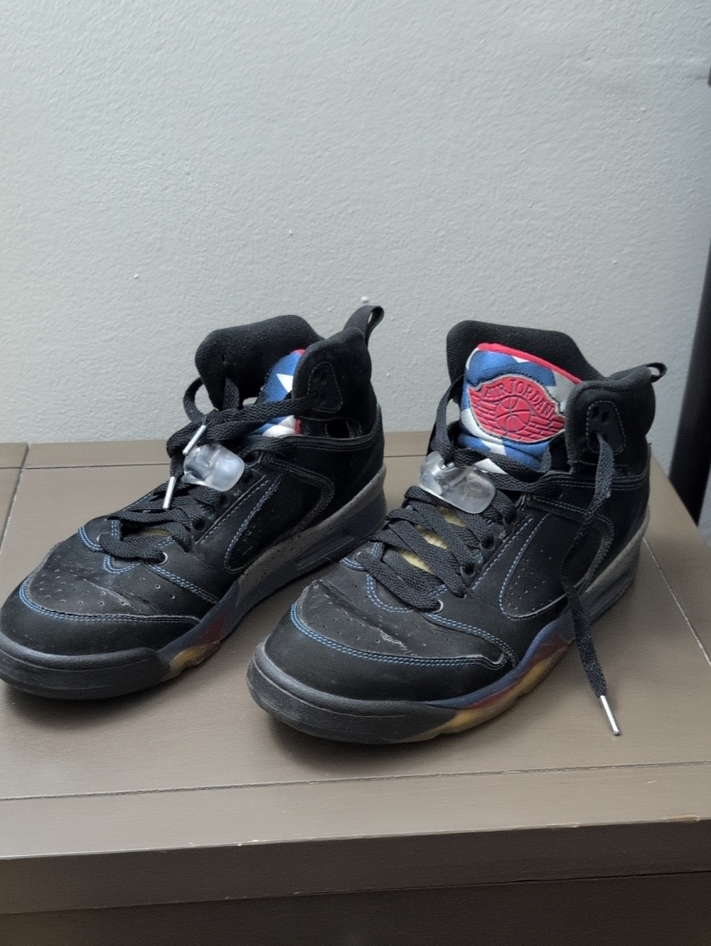 Jordan Black High-Top Sneakers with Red and Blue Accents